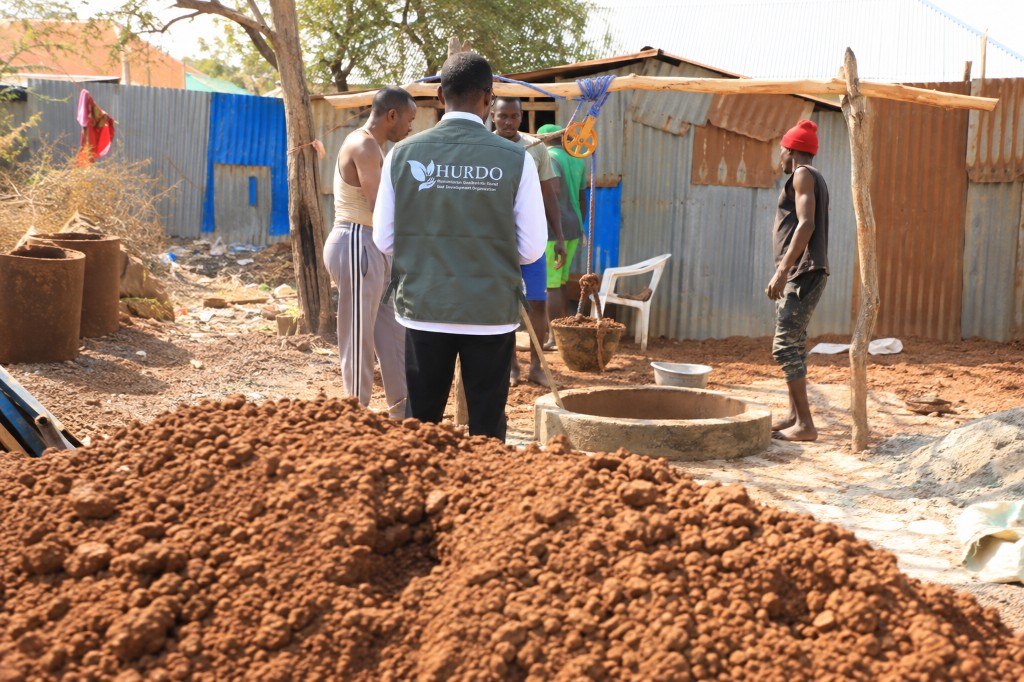 HURDO staff and community members at a newly constructed water well