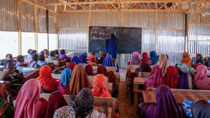 Students and a teacher in a classroom
