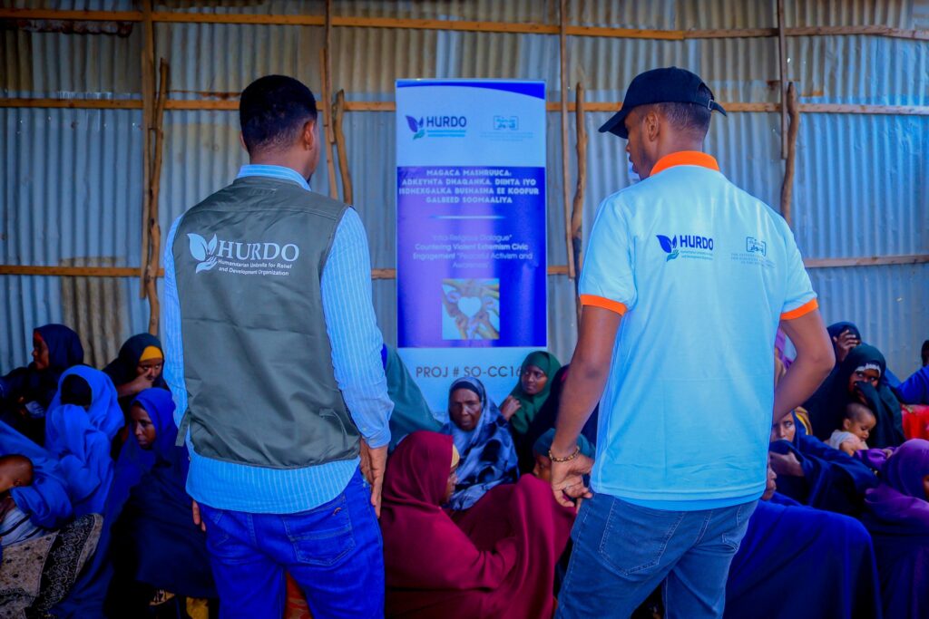 HURDO staff meeting with women and families in a community session